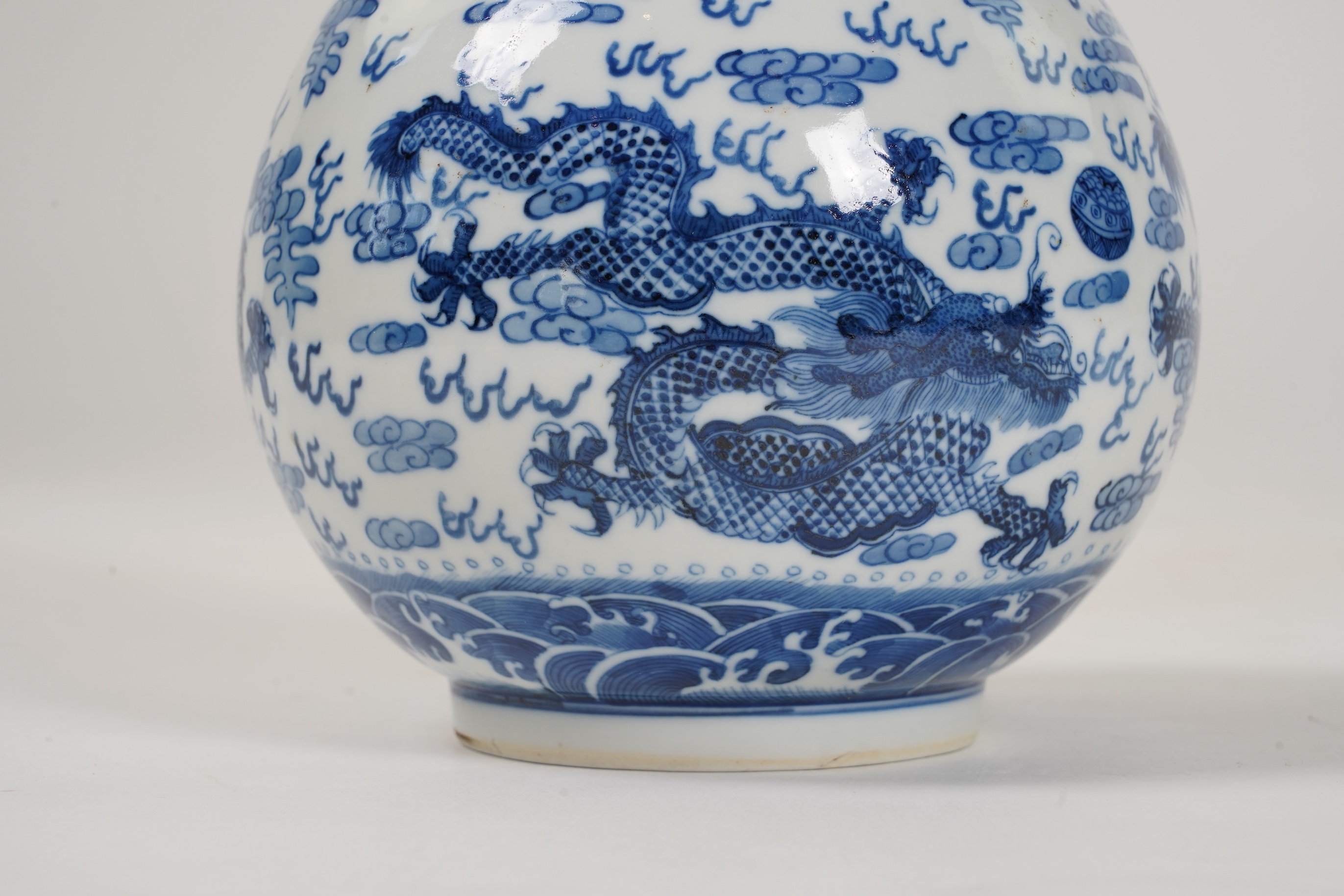 A Chinese blue and white 'dragon' bottle vase, 19th/20th century